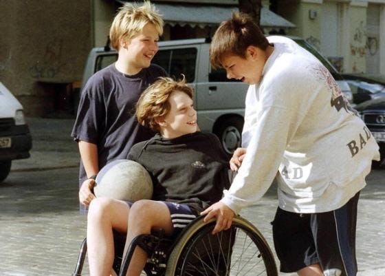 Kid in wheelchair with ball