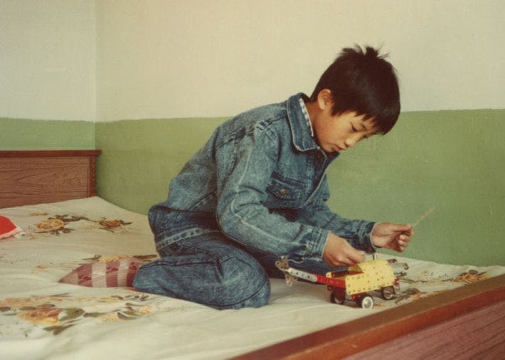 Child playing with Mecanno car