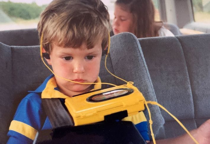 Child listening to walkman in car